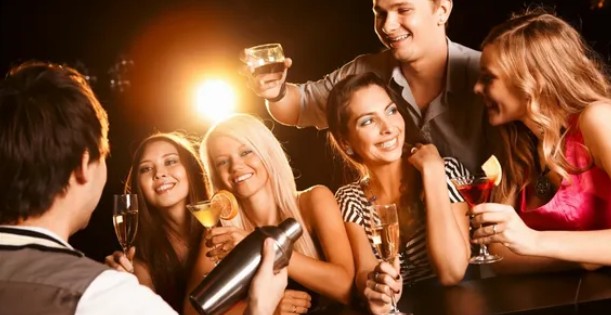 Friends celebrating with drinks at a party